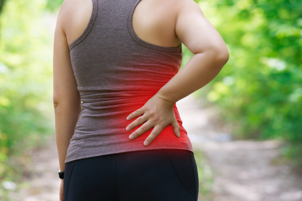 a woman suffering sciatica pain