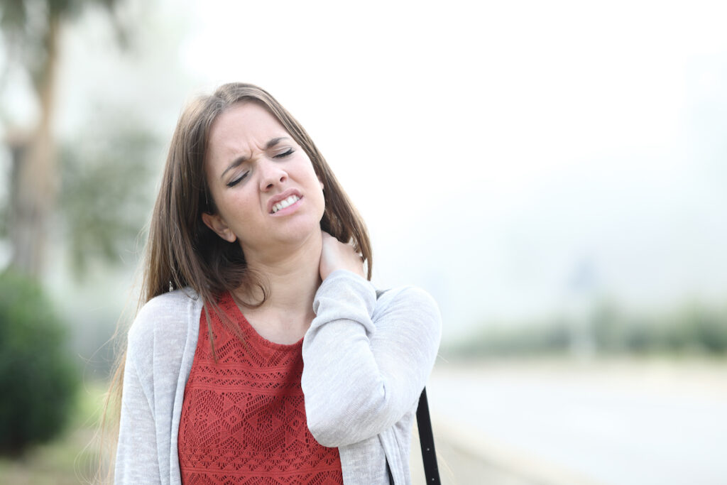 a woman having a fibromyalgia while walking