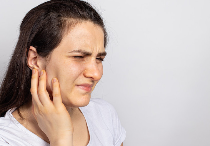 A woman suffering from a tooth ache