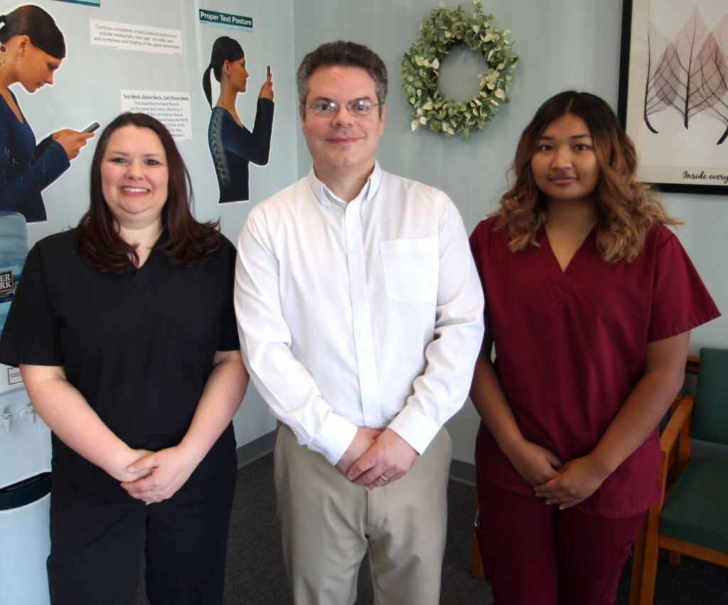 Dr. Craig Schulman together with the staff taking a photo together